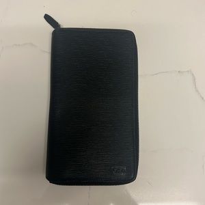 TUMI travel wallet leather